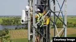 Workers for Alphabet's Taara project install receiving equipment for light beams that carry high-speed data signals through the air. (Photo Credit/Alphabet/X)