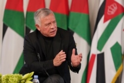 Jordan's King Abdullah II speaks during a meeting with tribal leader in Al-Qasta, south of Amman, Jordan, Oct. 4, 2021. King Abdullah II denied any impropriety in his purchase of luxury homes abroad.