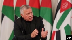 Jordan's King Abdullah II speaks during a meeting with tribal leader in Al-Qasta, south of Amman, Jordan, Oct. 4, 2021. King Abdullah II denied any impropriety in his purchase of luxury homes abroad.