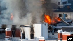 Flames engulf a building at South Africa's Parliament in Cape Town, Jan. 2, 2022. 