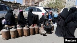 Women wait to fill up cooking gas cylinders outside a gas station amid supply shortage in Sanaa, Yemen, Nov. 7, 2017. 