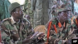 Leader of the Lord's Resistance Army, Joseph Kony, (L) and his deputy Vincent Otti in Ri-Kwamba, Southern Sudan (File)