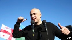 FILE - Nika Melia, head of the United National Movement, speaks to Georgian opposition supporters of former president Mikheil Saakashvili during a rally in his support in front of the prison where former president is being held, in Rustavi, Georgia, Oct. 4, 2021. 