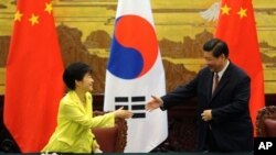 South Korean President Park Geun-hye, left, and Chinese President Xi Jinping, Great Hall of the People, Beijing, June 27, 2013.