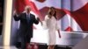 Capres Partai Republik, Donald Trump berjalan di panggung konvensi bersama istrinya, Melania di Cleveland, Ohio, Senin (18/7). 
