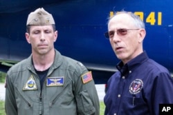 Base Commander Captain Mike Connor, commanding officer NAS Jacksonville and NTSB Vice Chairman Bruce Landsberg, right, speak about a plane crash, May 3, 2019, at a news briefing at the front gate of Naval Air Station in Jacksonville, Fla., Saturday.