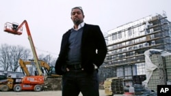 Architect Jonathan Garland is pictured at the construction site of a building he helped design in the Mattapan neighborhood of Boston, March 27, 2018. When Garland attended Boston Architectural College, but he didn’t see many who looked like him. There were few black students and even fewer black instructors.