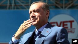 Turkey's President Recep Tayyip Erdogan gestures as he addresses his supporters during a referendum rally in Sanliurfa, Turkey, April 11, 2017.