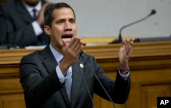 FILE - Venezuelan Congress President Juan Guaido, opposition leader who declared himself interim president, addresses the National Assembly in Caracas, Venezuela, March 6, 2019.