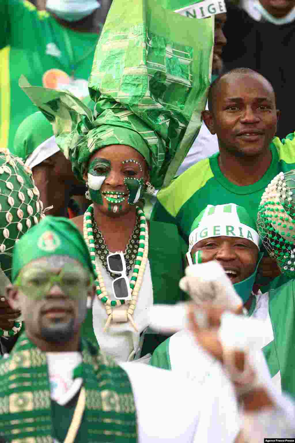 Nigerian supporters cheer before the match between Nigeria and Egypt at Stade Roumde Adjia in Garoua.