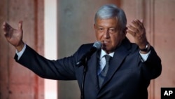 Mexico's President-elect Andres Manuel Lopez Obrador speaks to reporters after meeting with Mexico's President Enrique Pena Nieto at the National Palace in Mexico City, July 3, 2018.