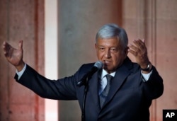 Mexico's President-elect Andres Manuel Lopez Obrador speaks to reporters after meeting with Mexico's President Enrique Pena Nieto at the National Palace in Mexico City, July 3, 2018.