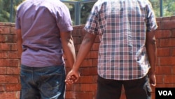 FILE - A Kenyan gay couple is seen holding hands. Homosexuality is illegal in at least 36 African countries, including Kenya. Penalties include prison and fines. (Photo - Rael Ombuor/VOA)