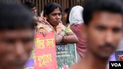 File - Bangladeshis participate in a rally marking International Literacy Day, in Dhaka, Bangladesh.