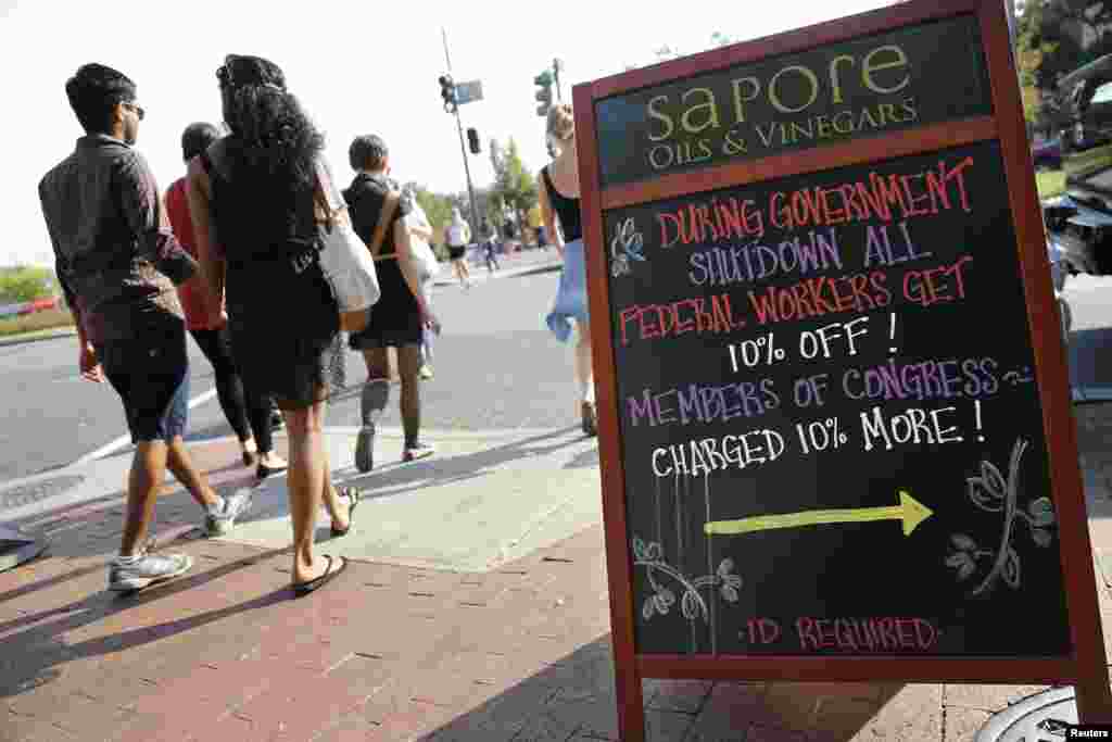 A sign for a gourmet shop advertises a deal for furloughed government workers in Capitol Hill in Washington, Oct. 5, 2013.&nbsp;