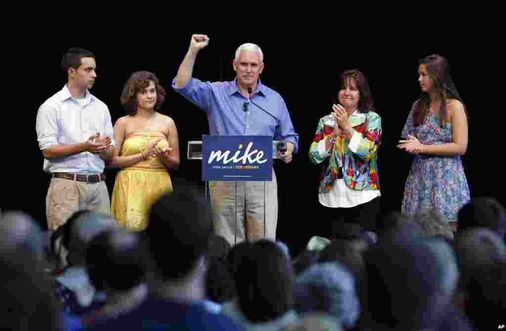 Rep. Mike Pence, center, surround by his family, left to right, son Michael, daughter Charlotte, his wife Karen and daughter Audrey as he kicked off his campaign for the Republican nomination for Governor of Indiana during a gathering of supporters in Columbus, Indiana, June 11, 2011. Pence promised to fight health care reform and federal climate change legislation.&nbsp;