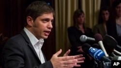 Axel Kicillof, Argentina's economy minister, addresses member of the news media after a negotiation session at the Argentinean Consulate in New York, July 30, 2014.