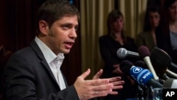 Axel Kicillof, Argentina's economy minister, addresses member of the news media after a negotiation session at the Argentinean Consulate in New York, July 30, 2014.