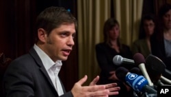 Axel Kicillof, Argentina's economy minister, addresses member of the news media after a negotiation session at the Argentinean Consulate in New York, July 30, 2014.