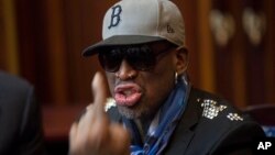 Dennis Rodman speaks with fellow U.S. basketball players during a team meeting at a Pyongyang, North Korea hotel, Jan. 7, 2014. 