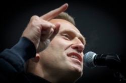 In this file photo taken on September 29, 2019 Russian opposition leader Alexei Navalny speaks during a demonstration in Moscow.