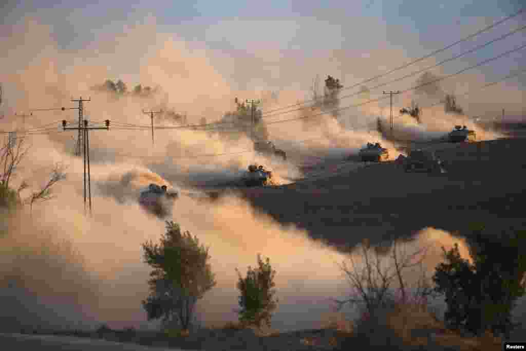 Israeli tanks maneuver outside the northern Gaza Strip. Israel intensified its land offensive in Gaza with artillery, tanks and gunboats on Friday and warned it could &quot;significantly widen&quot; the operation.
