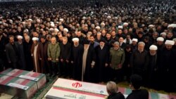 Description: Iran's Supreme Leader Ayatollah Ali Khamenei and President Hassan Rouhani pray near the coffins of Iranian Major-General Qassem Soleimani, head of the elite Quds Force, and Iraqi militia commander Abu Mahdi al-Muhandis, who were killed in an american air strike