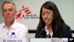 International President for Doctors Without Borders, Joanne Liu, right, pauses before speaking at the International Press Center in Brussels, Sept. 7, 2017. The head of medical aid group Doctors Without Borders says European governments are paying for the