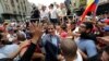 Venezuelan opposition leader Juan Guaido, whom many nations have recognized as the country's rightful interim ruler, greets supporters during a rally in Los Teques, Venezuela, March 30, 2019. 