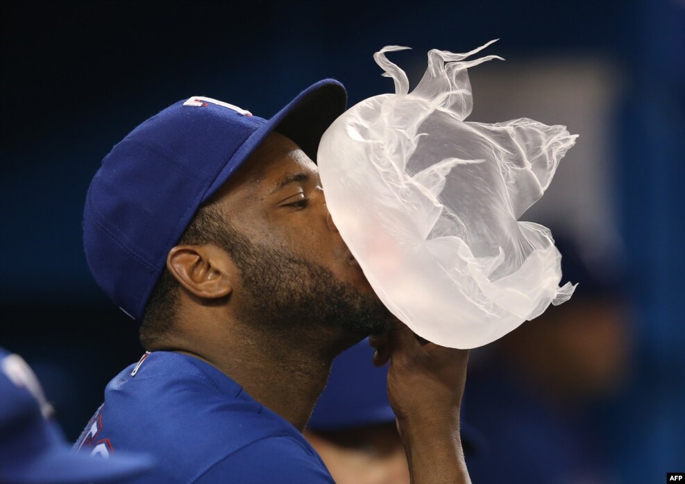 Hanser Alberto #2 of the Texas Rangers blows a large bubble as it bursts during MLB game action against the Toronto Blue Jays on May 4, 2016 at Rogers Centre in Toronto, Ontario, Canada. 