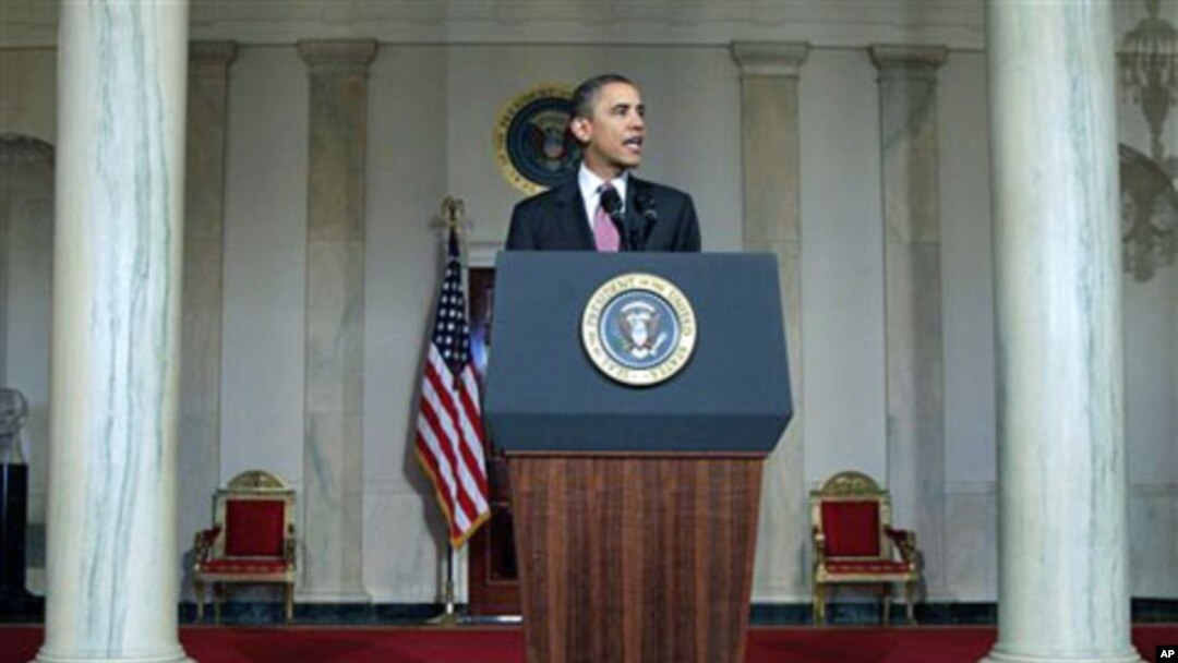 President Barack Obama makes a statement on the resignation of Egypt's President Hosni Mubarak in the Grand Foyer at the White House in Washington, February 11, 2011