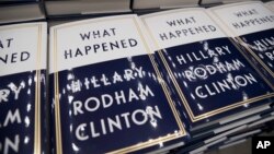 FILE - A box of Hillary Clinton's book "What Happened" are staged to be distributed outside the Warner Theatre in Washington, Sept. 18, 2017.