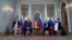 Russian President Vladimir Putin and U.S. President Donald Trump, with their interpreters at the beginning of their meeting at the Presidential Palace in Helsinki, Finland, July 16, 2018.