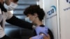 یک نوجوان اسرائیلی در حال دریافت واکسن کووید۱۹ - ۲۴ ژانویه ۲۰۲۱