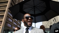 FILE - R. Kelly departs the Leighton Criminal Court building after pleading not guilty to sex-related charges, in Chicago, Illinois, June 6, 2019.