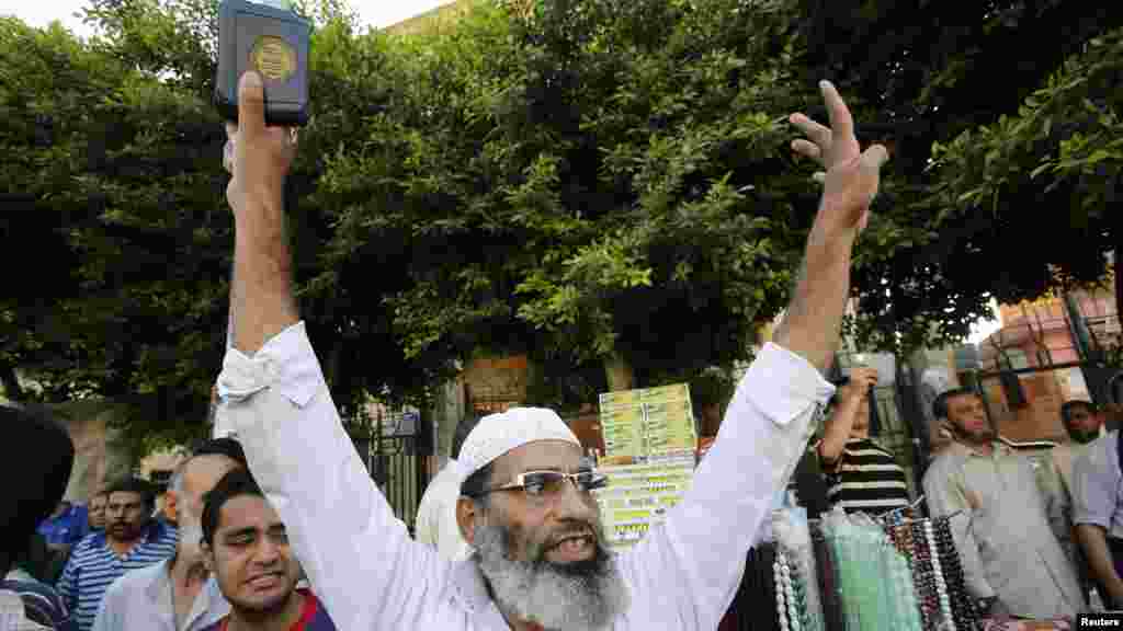 A supporter of the Muslim Brotherhood and ousted Egyptian President Mursi shouts slogans against the military, August 19, 2013.