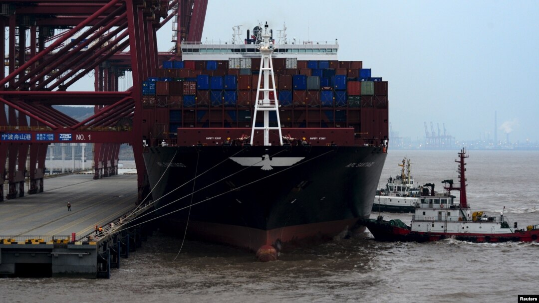 A cargo ship is anchored at a port in Zhoushan, Zhejiang province, Feb. 14, 2016. China's exports fell 11.2 percent in January from a year earlier and imports tumbled 18.8 percent.