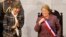 Chile's President Michelle Bachelet smiles next to Senate President Isabel Allende (L), daughter of late former President Salvador Allende, after delivering her annual address at the national congress building in Valparaiso city, northwest of Santiago, Ma