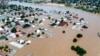 FILE - Homes and other buildings are partially submerged following a dam collapse, in Maiduguri, Nigeria, Sept 10, 2024.