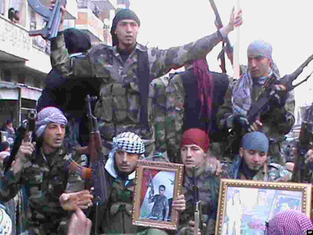 Members of the Free Syrian Army demonstrate against Syria's President Bashar al-Assad in Marat al-Numan near the northern province of Idlib January 15, 2012 . (Reuters)