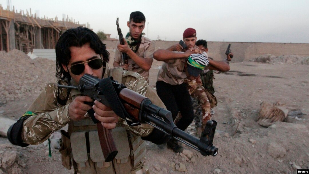 FILE - Shi'ite volunteers, who have joined the Iraqi army to fight against Islamic State militants, take part in a military-style training in Basra, Iraq. 