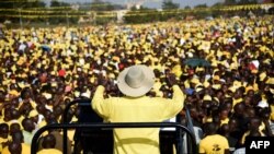 FILE - Ugandan President Yoweri Museveni addresses supporters in Kampala, Feb. 16, 2016. Controversial new rules ban mass gatherings during campaigning for the 2021 general election. 