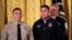 President Donald Trump awards the public safety Medal of Valor to Officer Nicholas Koahou of Redlands (Calif.) Police Department during a ceremony in the East Room of the White House, Feb. 20, 2018. Standing on the left is fellow awardee Corporal Rafael Ixco of San Bernardino County Sheriff's Department, Calif. 