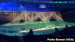 FILE - Lights flood the stage during the Rio Olympics' opening ceremonies in Maracana Stadium, Rio de Janeiro, Brazil, Aug. 5, 2016.