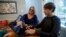 Jodi Smith Lemacks, left, works with her son, Joshua, in their home in Richmond, Va., Tuesday, Oct. 16, 2018. Lemacks is nervous about changing or losing her job because that could mean cutting off her son Joshua from heart specialists he’s seen his entire life. 
