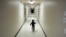 FILE - An asylum-seeking boy from Central America runs down a hallway after arriving from an immigration detention center to a shelter in San Diego, Dec. 11, 2018.