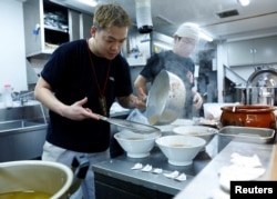 Ramen shop Menya Taisei's owner Taisei Hikage cooks ramen at his shop in Tokyo, Japan, October 22, 2024. (REUTERS/Kim Kyung-Hoon)