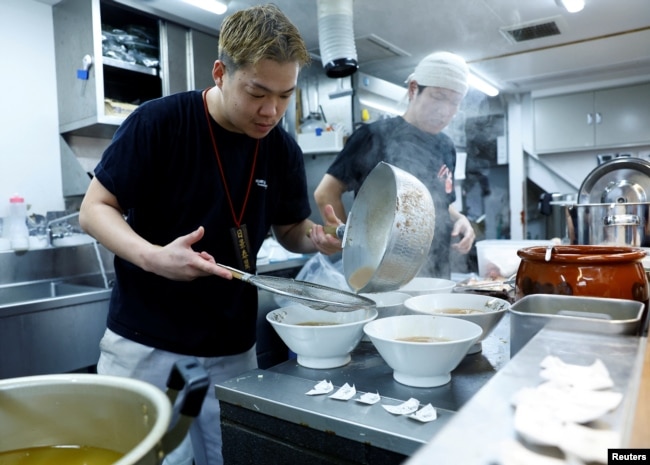 Ramen shop Menya Taisei's owner Taisei Hikage cooks ramen at his shop in Tokyo, Japan, October 22, 2024. (REUTERS/Kim Kyung-Hoon)