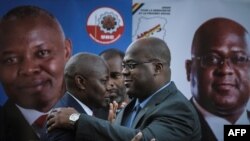 Vital Kamerhe (à g.), s’était désisté en faveur de Felix Tshisekedi (à dr.) lors de l'élection présidentielle de 2018. (Photo Yasuyoshi CHIBA / AFP)