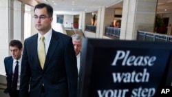 FILE - Bryan Pagliano, a former State Department employee who helped set up and maintain a private email server used by Hillary Rodham Clinton, departs Capitol Hill, Sept. 10, 2015.